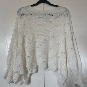 Cream sweater. Drapes like poncho.